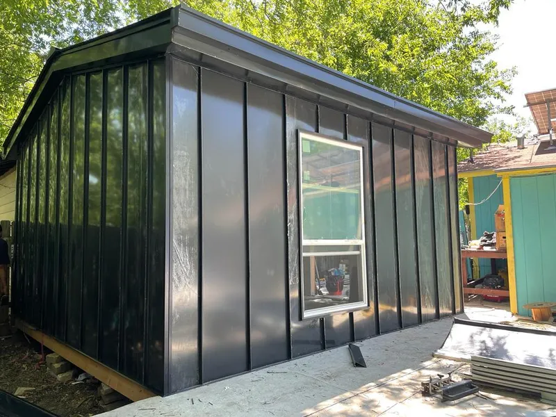 Black standing seam metal wall panels for Metal Roof Installation in White House