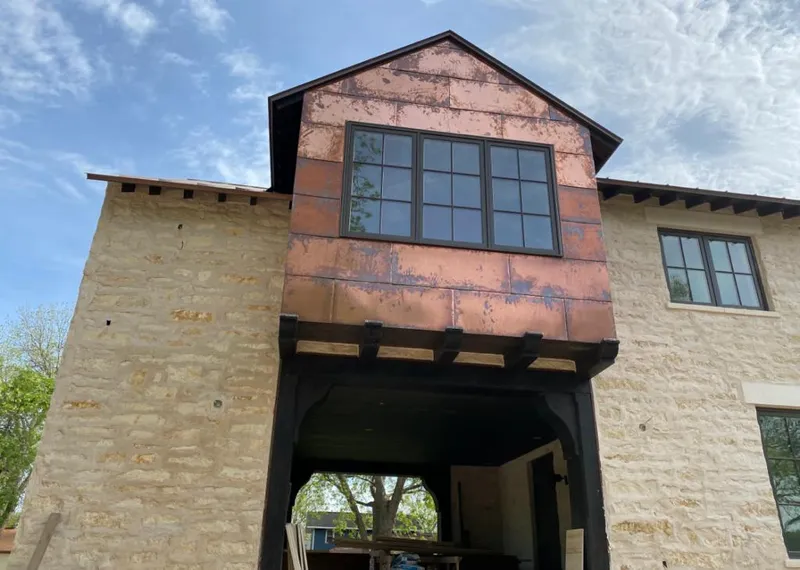 Copper metal panel facade on a stone building for Skylight Installation in White House